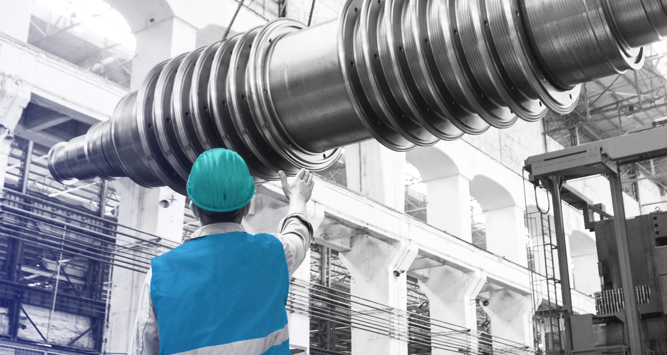 Technician inspecting industrial turbine equipment